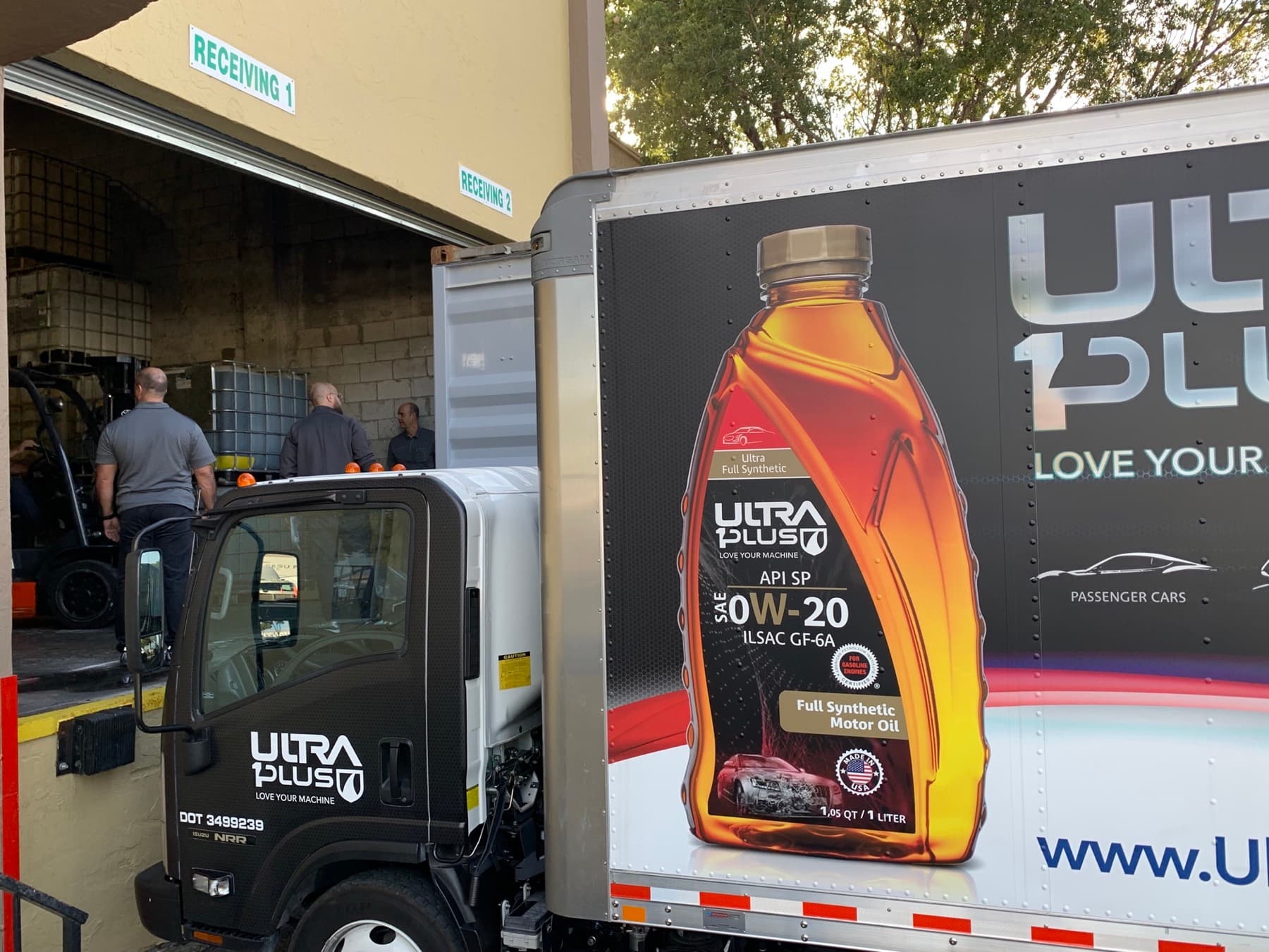 Branded lubricant delivery truck loading at the Doral distribution center