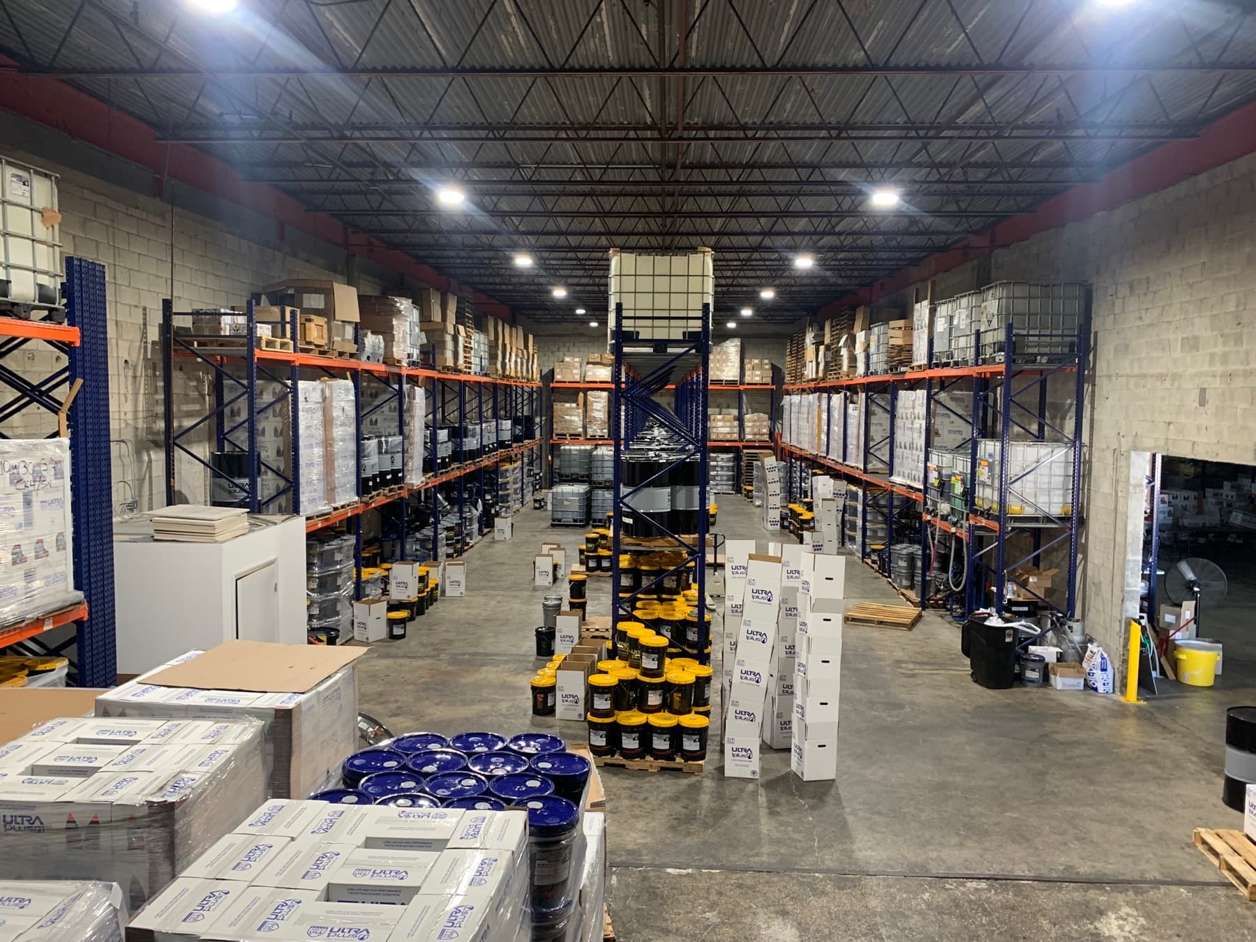 Stocked lubricant inventory inside the MAXILUB distribution warehouse in Doral, Florida